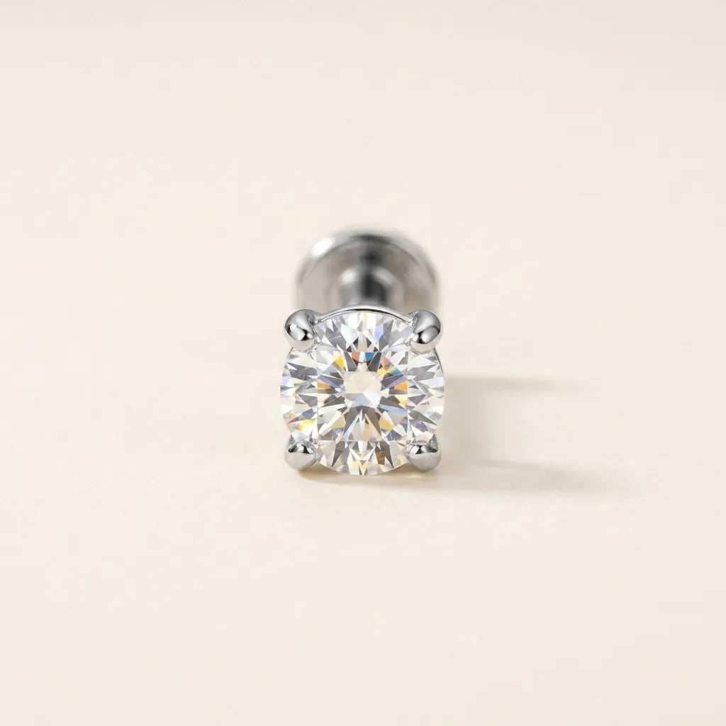 Silver titanium Ashley solitaire piercing worn in the center of the lower lip
