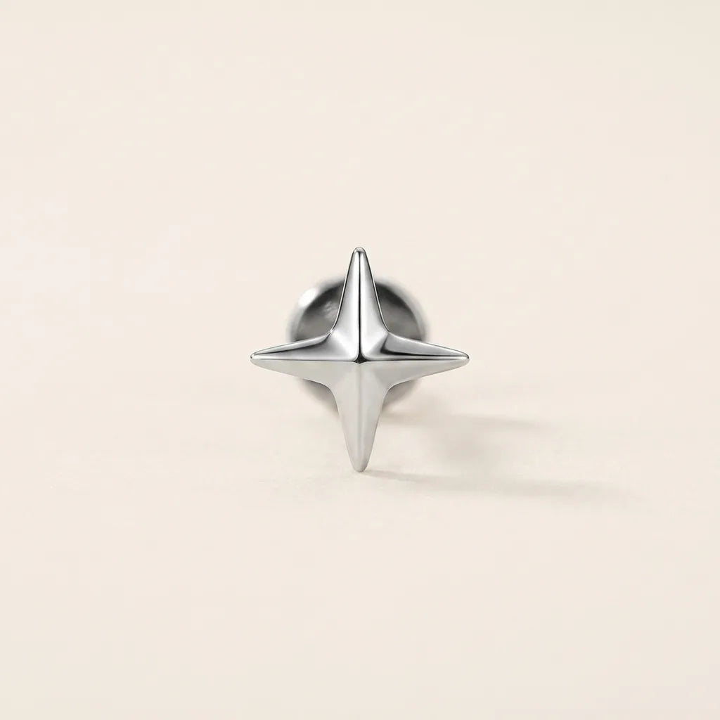 Natural silver titanium Ashley piercing four pointed star stud, front view
