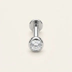 Titanium Ashley piercing solitaire studs in silver and gold finishes side by side
