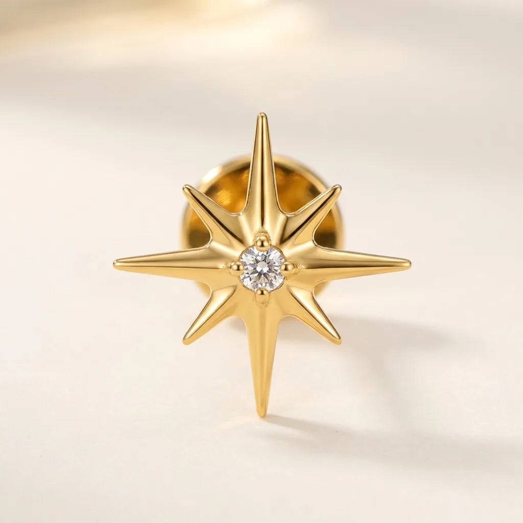Gold titanium Ashley piercing celestial starburst stud with CZ, front view
