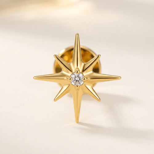 Gold titanium Ashley piercing celestial starburst stud with CZ, front view
