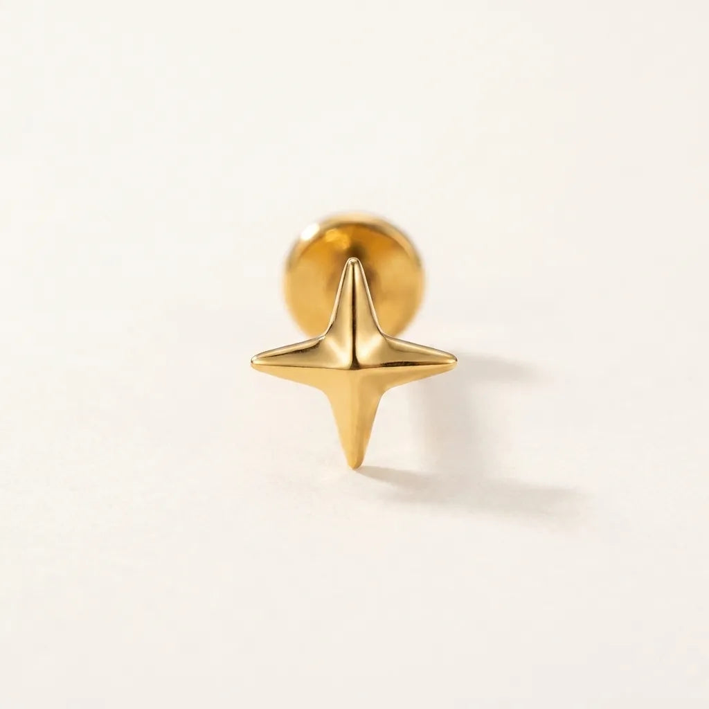 Gold titanium Ashley piercing four pointed star stud, front view
