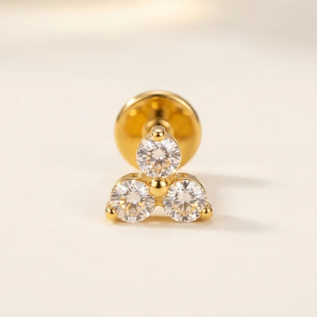 Gold titanium Ashley piercing trinity CZ cluster stud, front view
