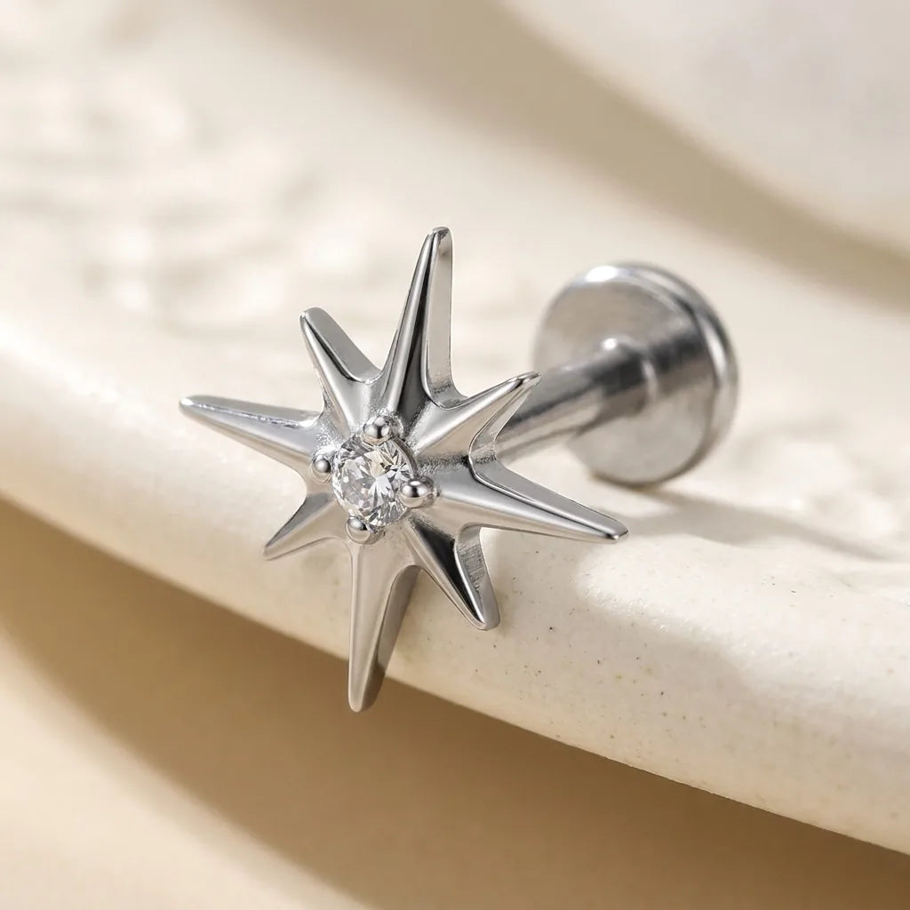 Natural silver titanium Ashley celestial starburst labret, three quarter angle
