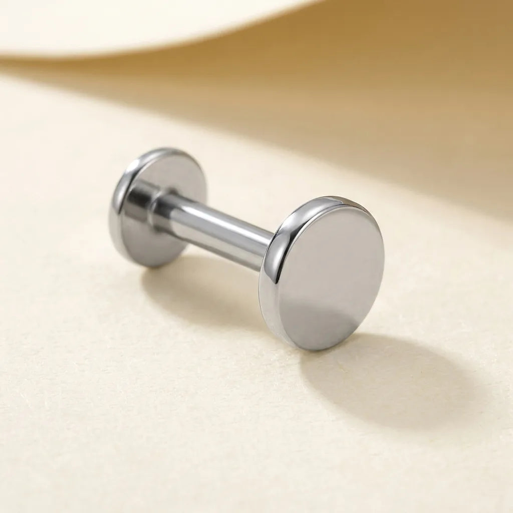 Natural silver titanium Ashley flat disc labret, three quarter angle
