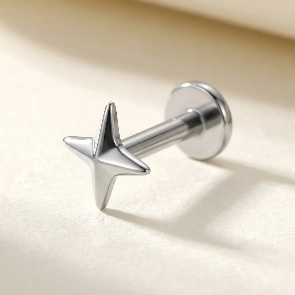 Natural silver titanium Ashley four pointed star labret, three quarter angle
