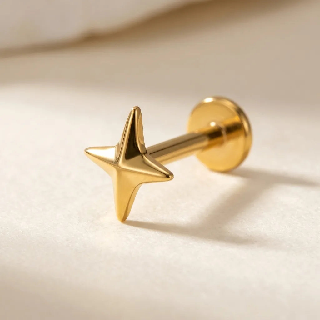 Gold titanium Ashley four pointed star labret, three quarter angle
