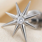 Macro close up of a titanium Ashley celestial starburst stud with a center CZ
