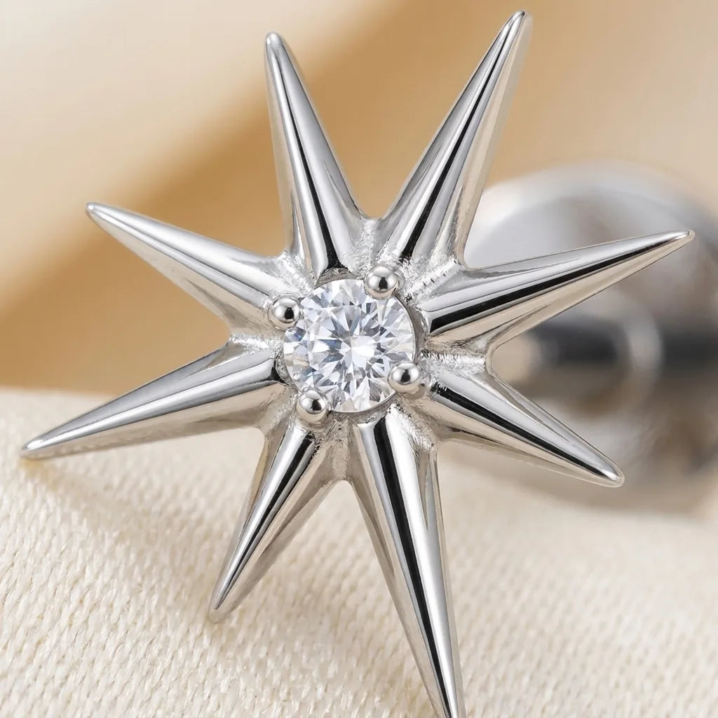 Macro close up of a titanium Ashley celestial starburst stud with a center CZ
