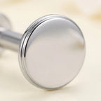Macro close up of a mirror polished titanium Ashley flat disc stud
