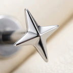 Macro close up of a mirror polished titanium Ashley four pointed star stud

