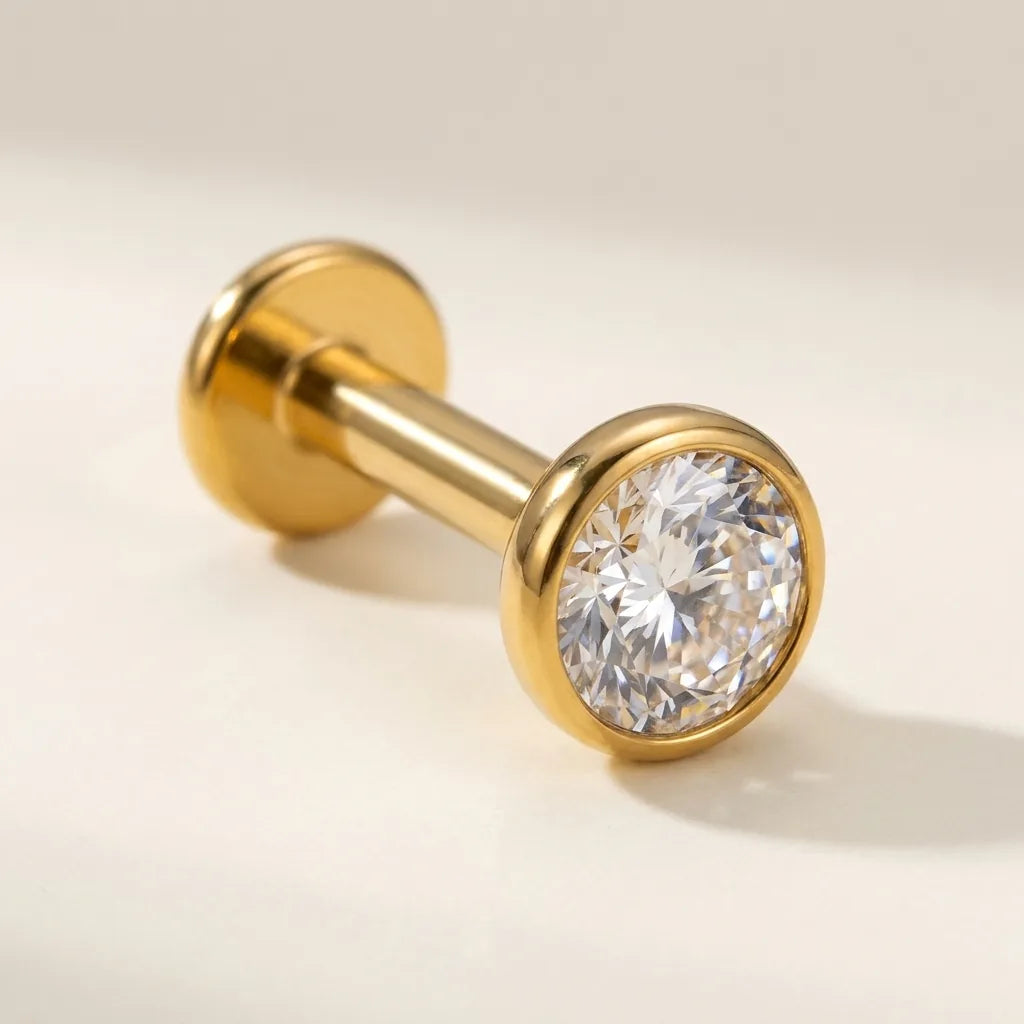 Gold titanium Ashley piercing solitaire stud with a bezel set CZ, front view
