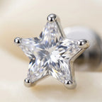 Macro close up of a star cut cubic zirconia held in titanium prongs
