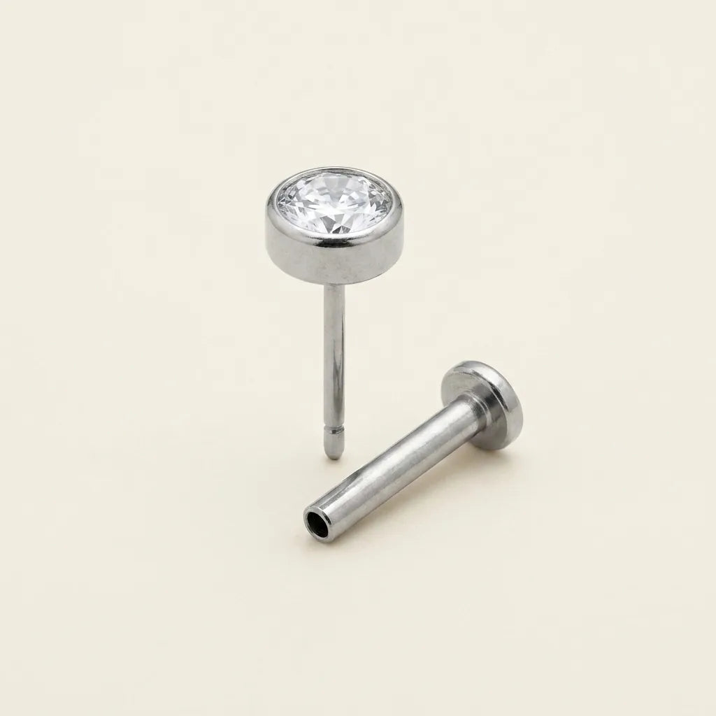 Threadless titanium Ashley solitaire labret with the top and post separated
