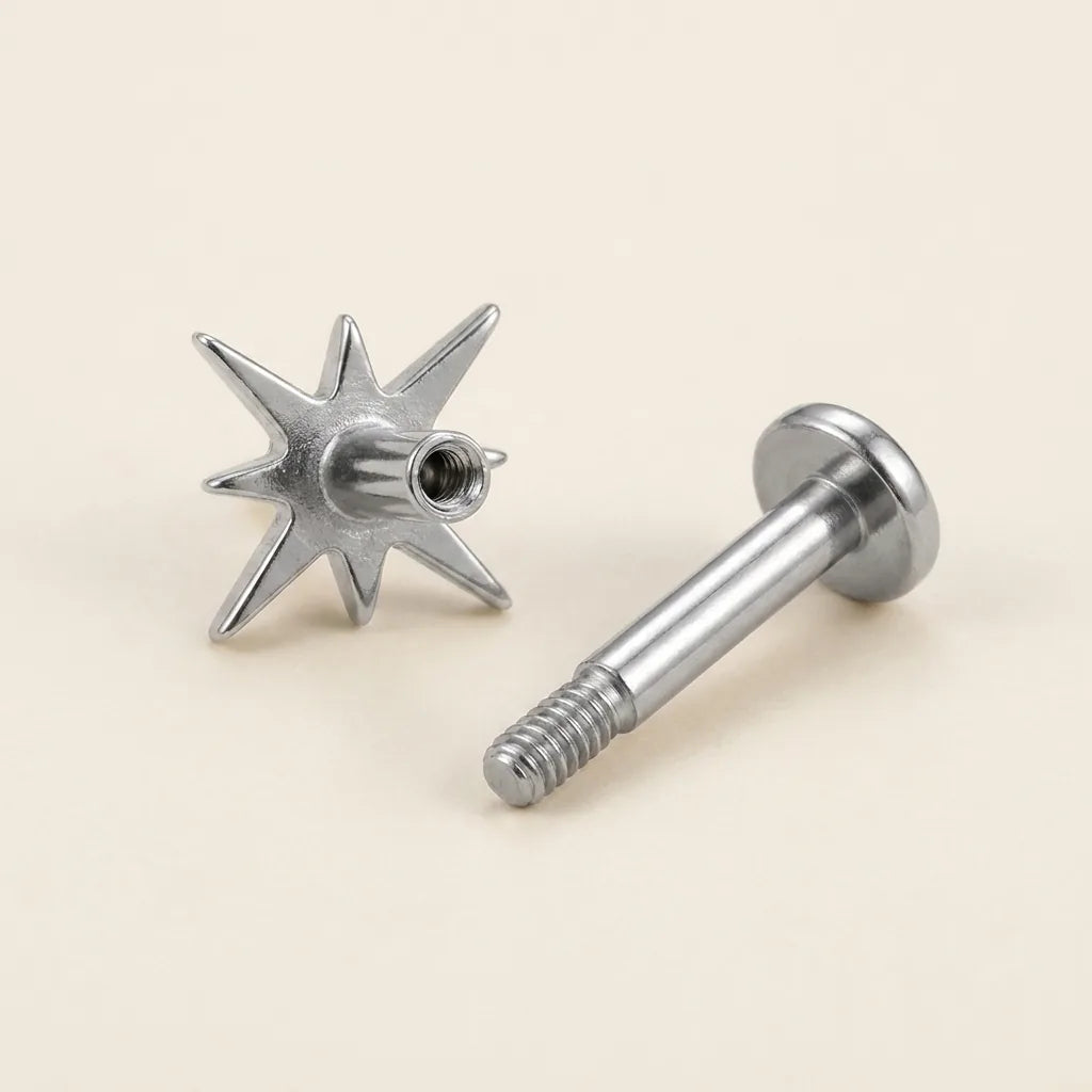 Internally threaded titanium Ashley celestial labret with the top and post separated
