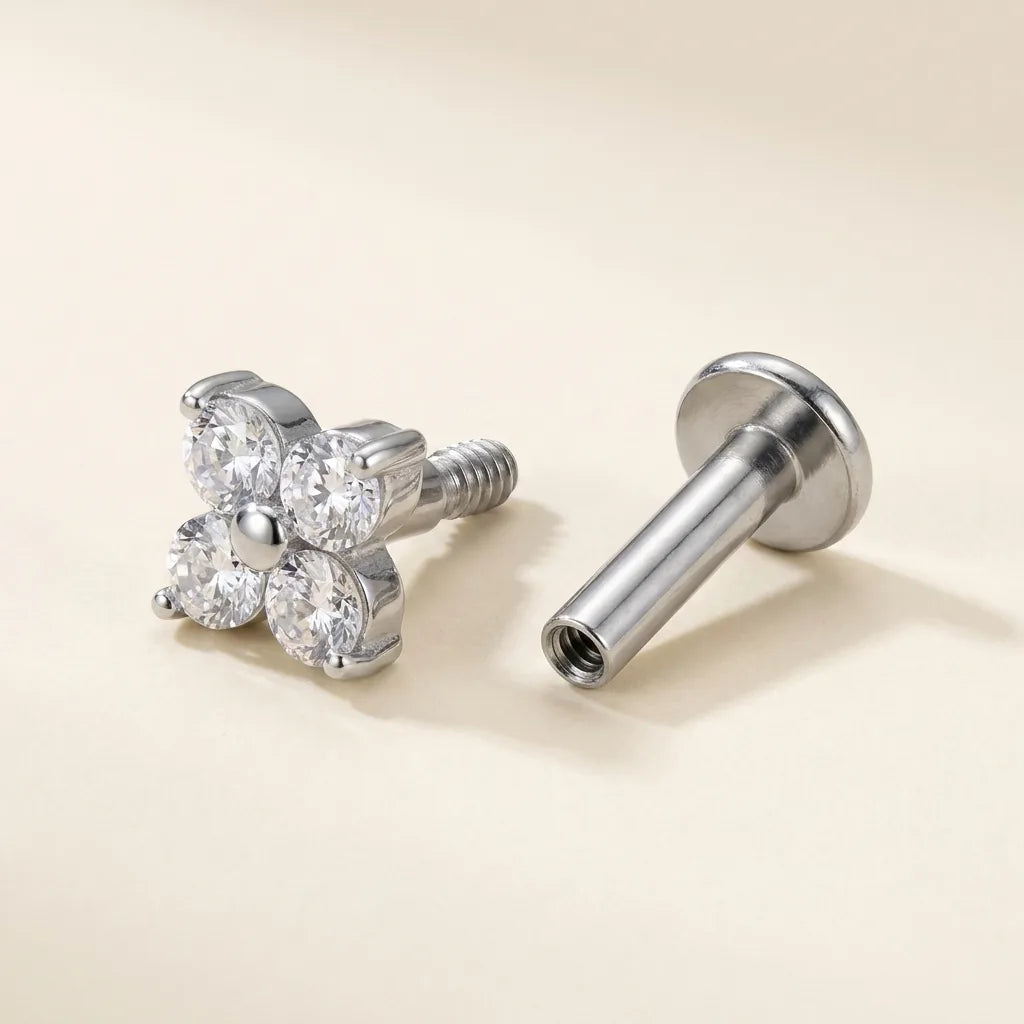 Internally threaded titanium Ashley clover labret with the top and post separated
