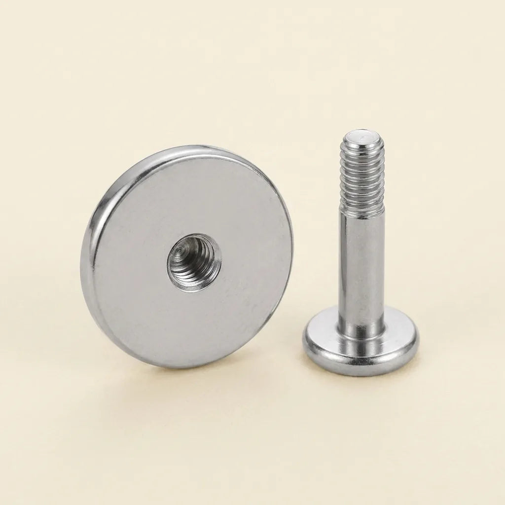 Internally threaded titanium Ashley disc labret with the top and post separated
