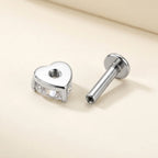 Internally threaded titanium Ashley heart labret with the top and post separated

