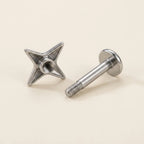 Internally threaded titanium Ashley star labret with the top and post separated
