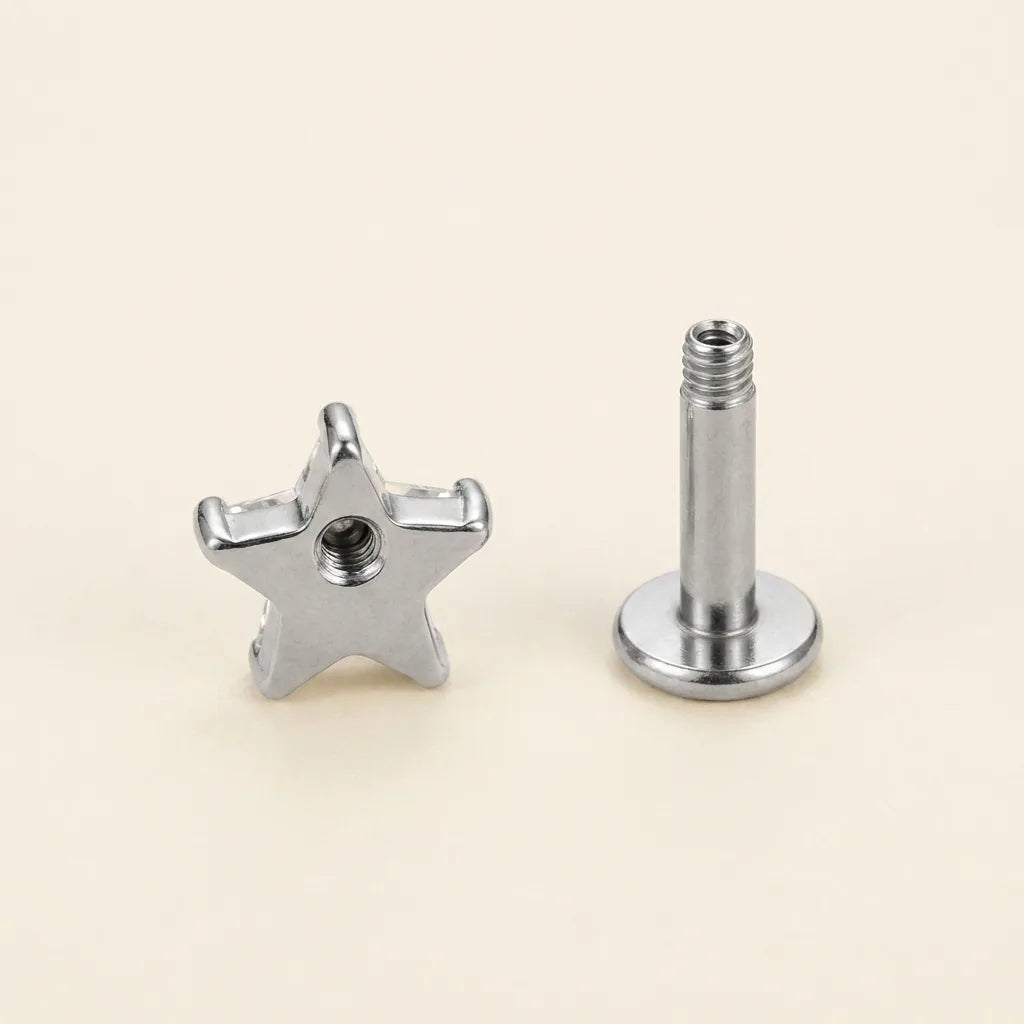 Internally threaded titanium Ashley star cut labret with the top and post separated

