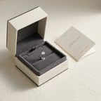 Ashley piercing gift packaging with a titanium solitaire stud and a certificate card
