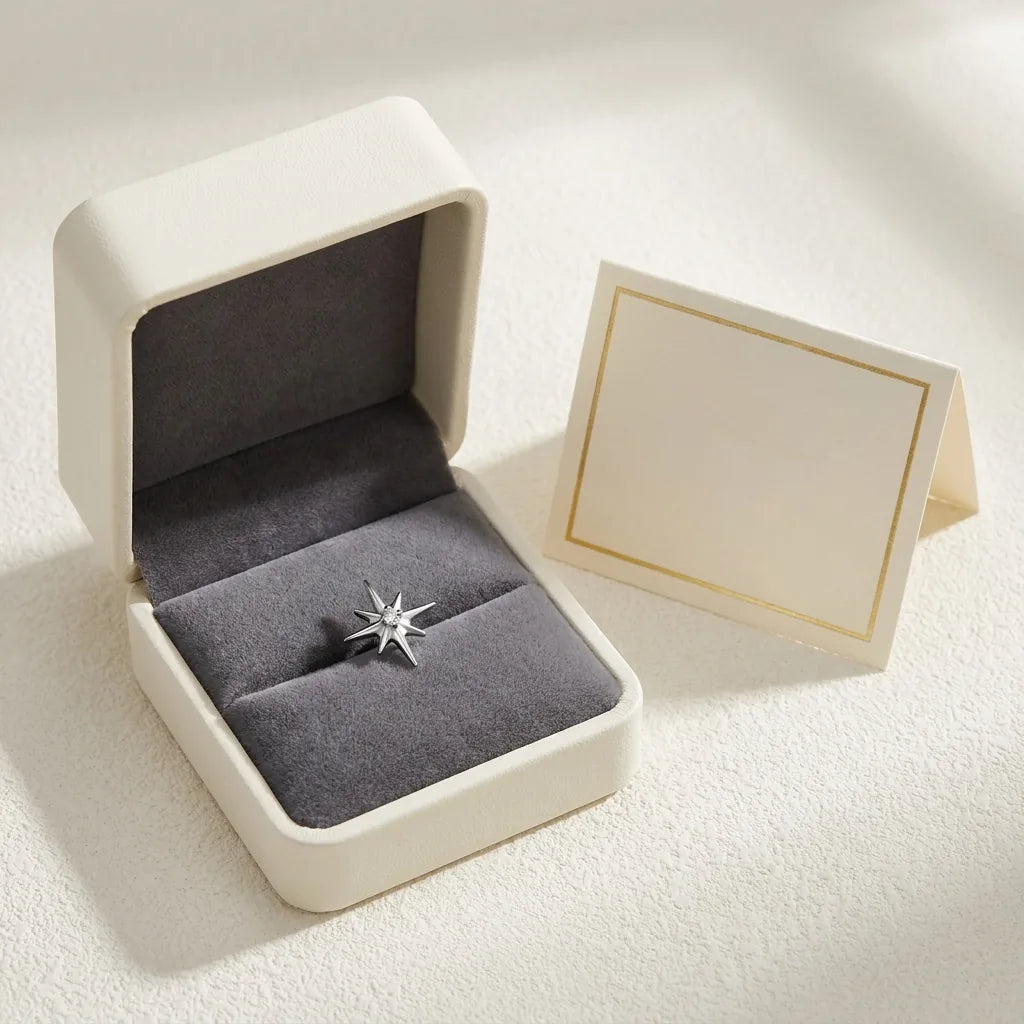 Ashley celestial piercing gift packaging with a titanium stud and a certificate card
