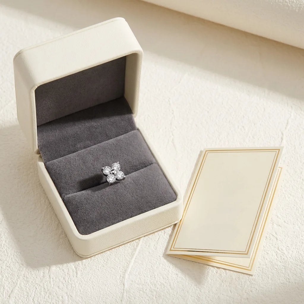 Ashley clover piercing gift packaging with a titanium stud and a certificate card

