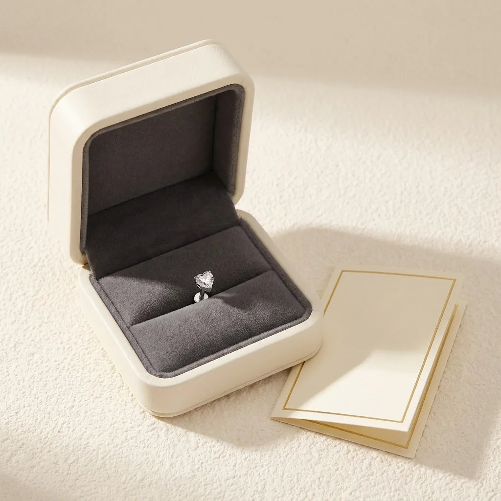 Ashley heart piercing gift packaging with a titanium stud and a certificate card
