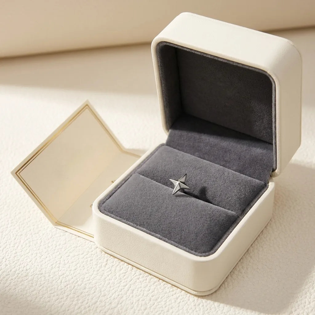 Ashley star piercing gift packaging with a titanium stud and a certificate card
