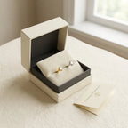 Ashley piercing gift packaging with silver and gold titanium studs and a certificate card
